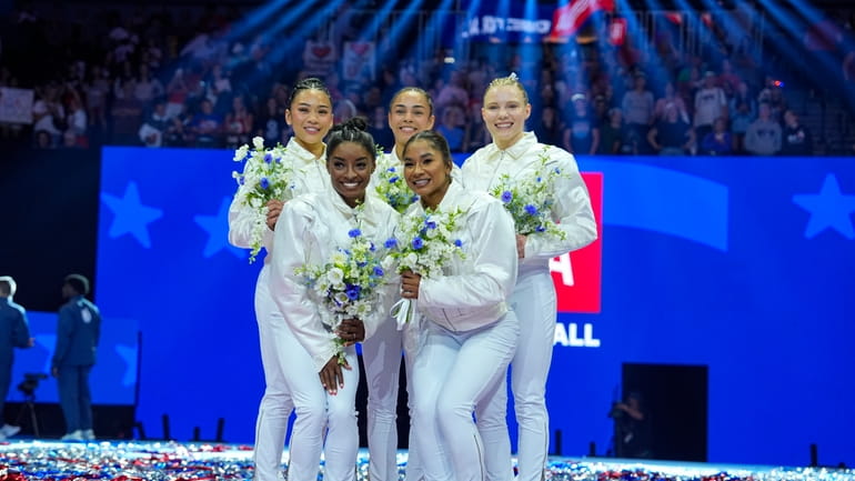 The U.S. women's team from left to right, Suni Lee,...