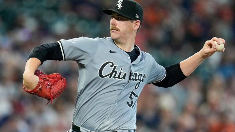 Chicago White Sox starting pitcher Ky Bush throws against the...