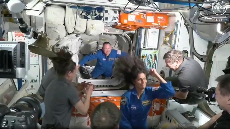 NASA astronauts Barry Wilmore and Sunita Williams are welcomed by the...