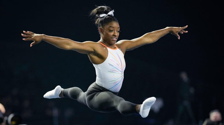 Simone Biles warms up before competing in the U.S. Classic...