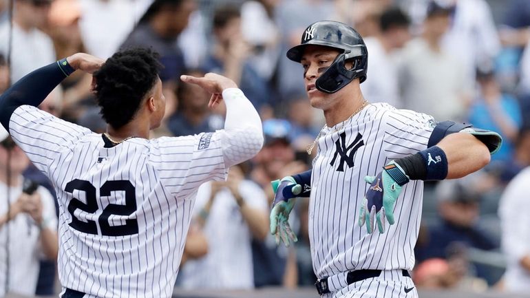 Aaron Judge of the New York Yankees celebrates his fourth...