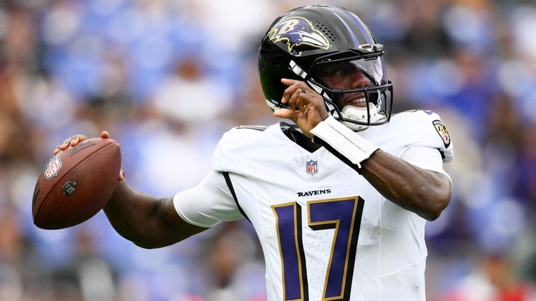 Baltimore Ravens quarterback Josh Johnson passes against the Atlanta Falcons...