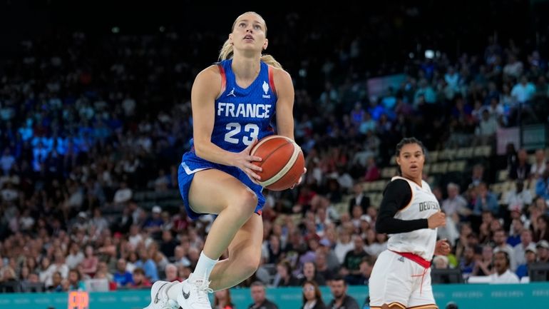 Marine Johannes (23), of France, shoots against Germany during a...