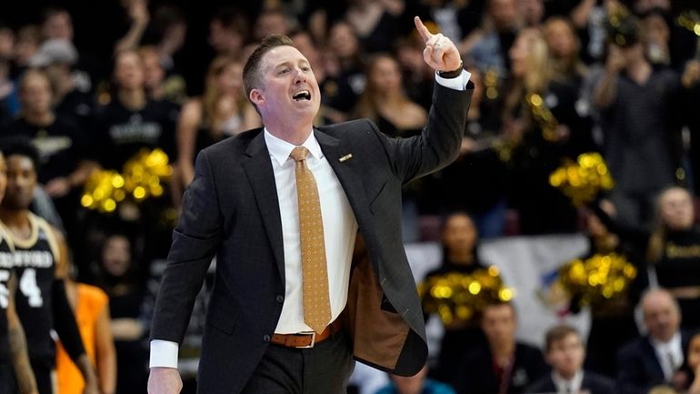 Wofford head coach Jay McAuley directs his team against East...