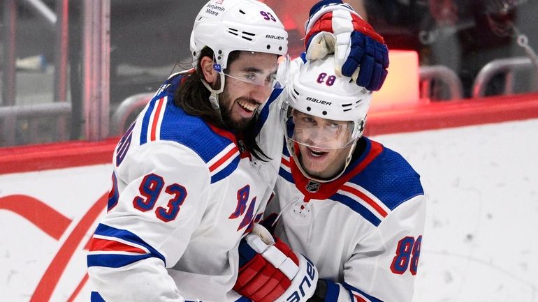 Rangers center Mika Zibanejad (93) celebrates his goal with right...