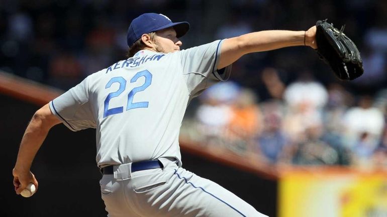 The Dodgers' Clayton Kershaw deals a pitch against the Mets...