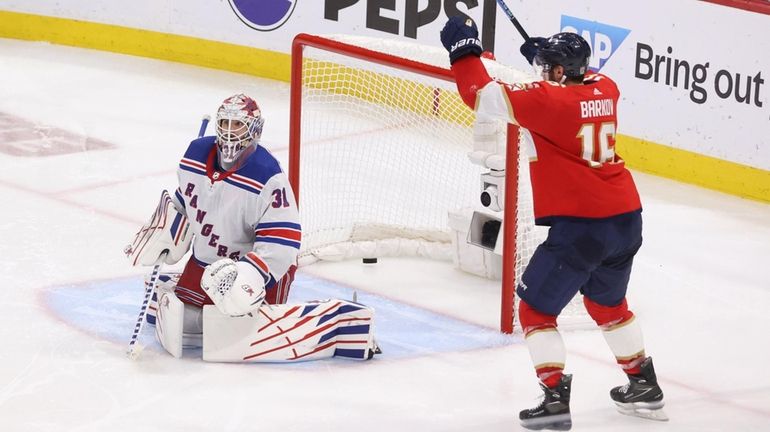 Aleksander Barkov #16 of the Florida Panthers celebrates the game-winning...