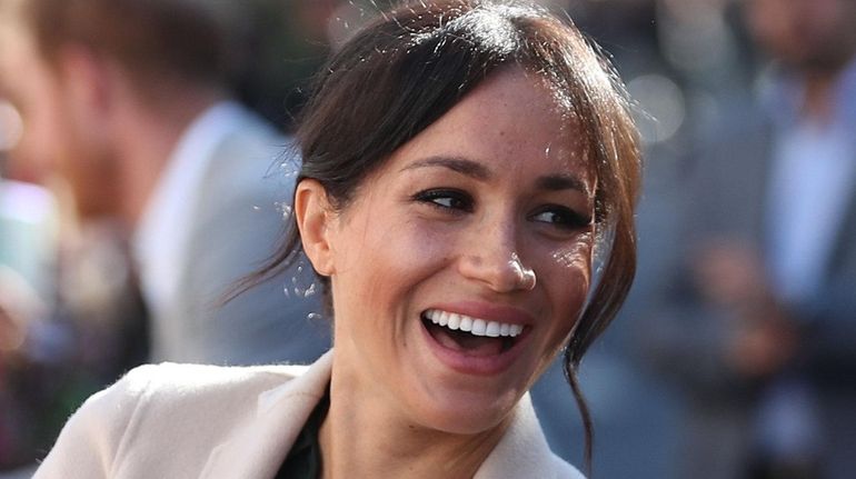 Meghan, Duchess of Sussex, greets well-wishers on arrival in Chichester,...