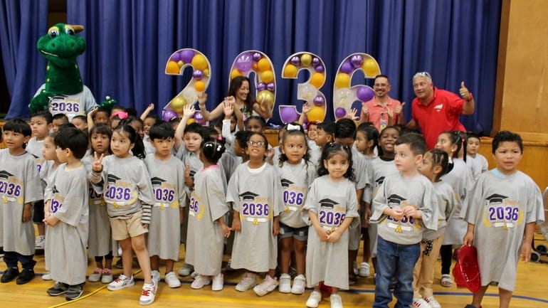 Incoming Central Islip kindergarteners, wearing Class of 2036 t-shirts, and their...