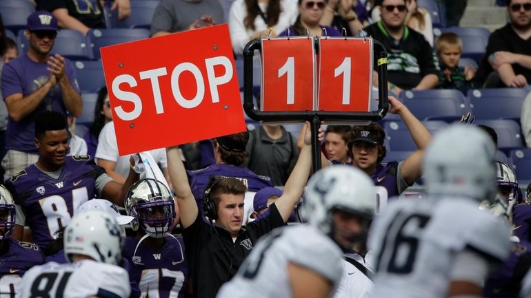 A play is signaled from the Washington sideline in the...