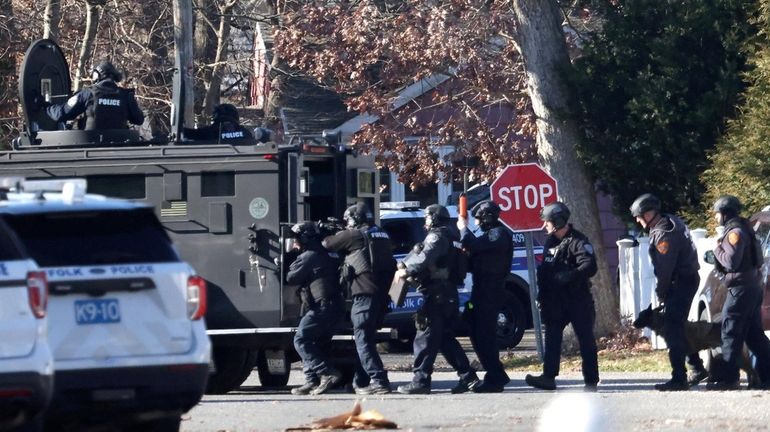 Suffolk police respond to the scene on Wiggins Street in...