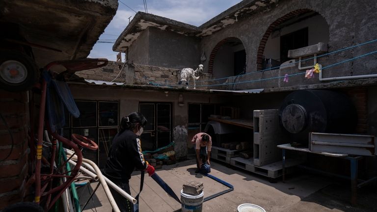 Rosa Daniel, left, helps her neighbor Juana Salazar Segundo move...