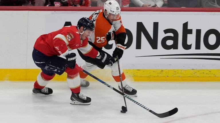 Florida Panthers defenseman Dmitry Kulikov (7) and Philadelphia Flyers center...