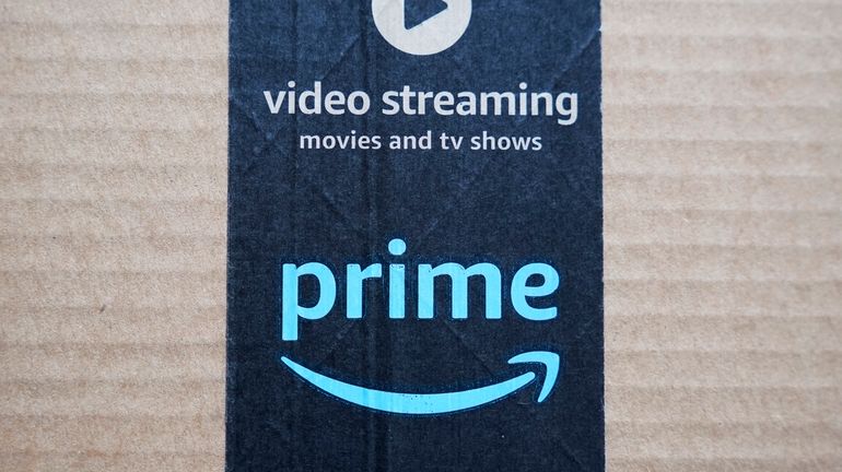 An Amazon Prime cardboard shipping box label is seen on...