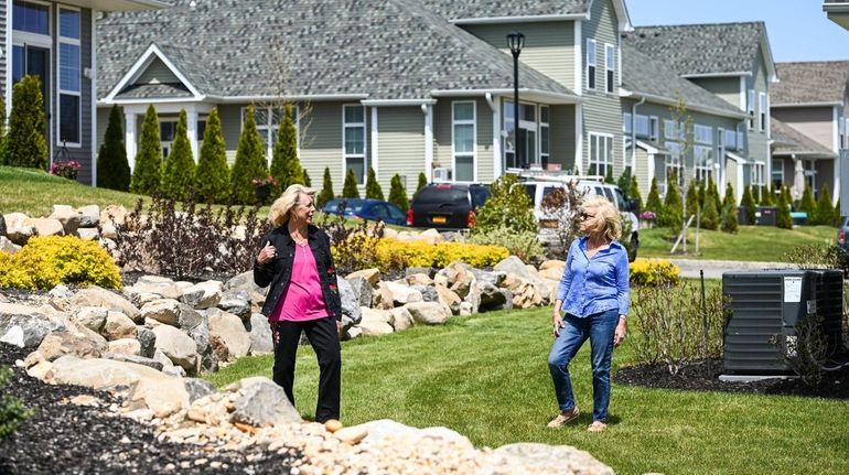 Lorraine Pizzo, left, and Linda Balfour talk from a distance at...