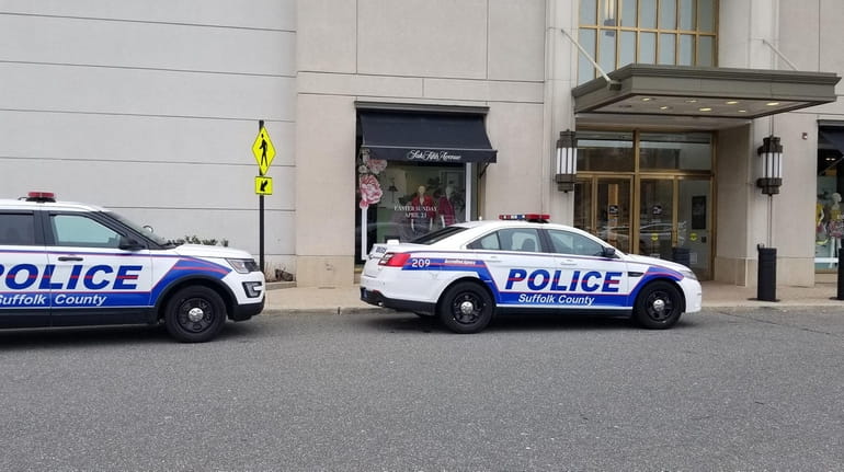 Suffolk police outside the Saks Fifth Avenue store at Walt...