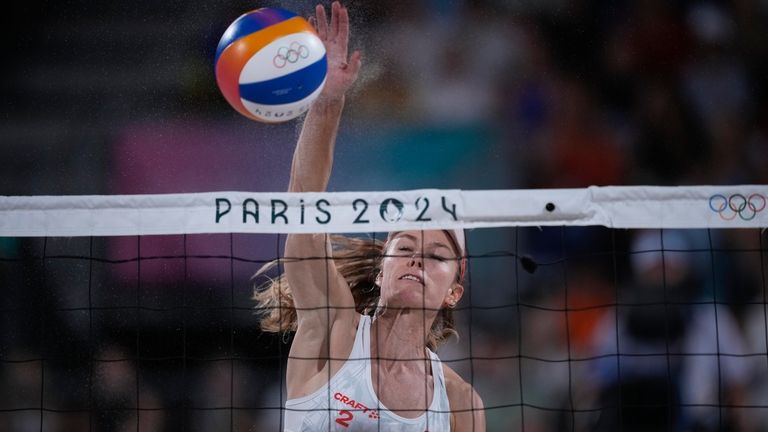 Switzerland's Nina Brunner hits the ball in the women's beach...