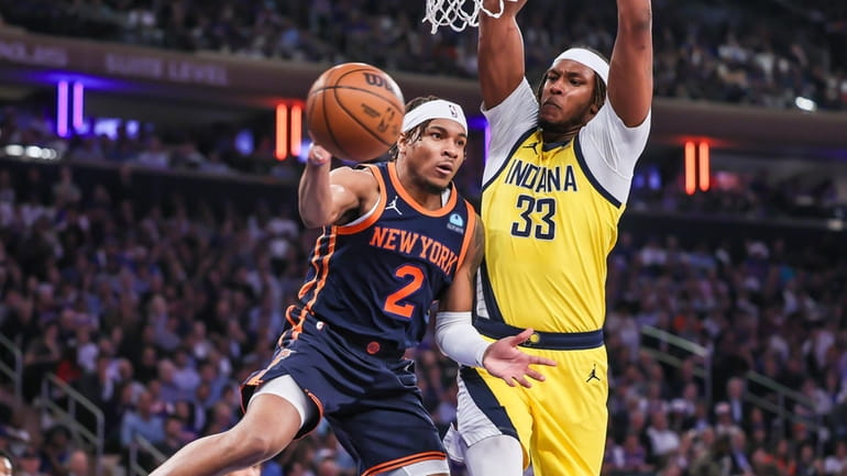 New York Knicks’ Miles McBride passing the ball around the...