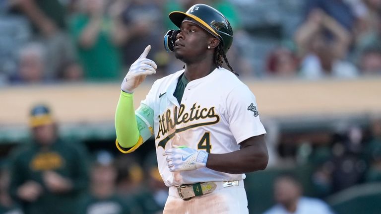 Oakland Athletics' Lawrence Butler gestures after hitting a home run...