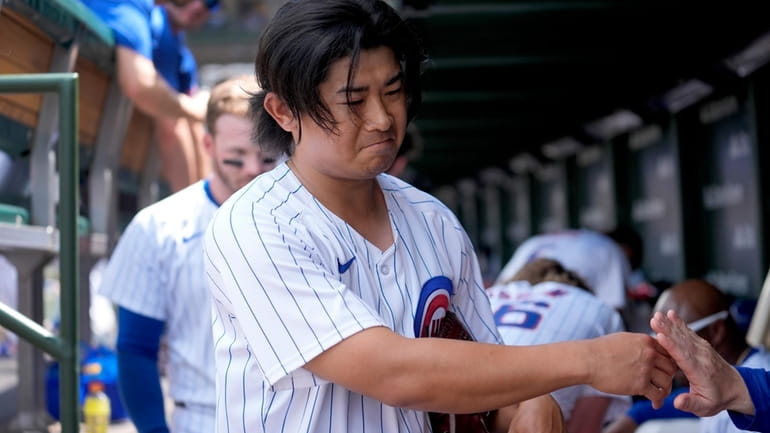 Chicago Cubs pitcher Shota Imanaga heads to the tunnel after...