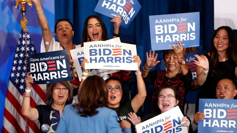 Supporters cheer Vice President Kamala Harris during a campaign rally...