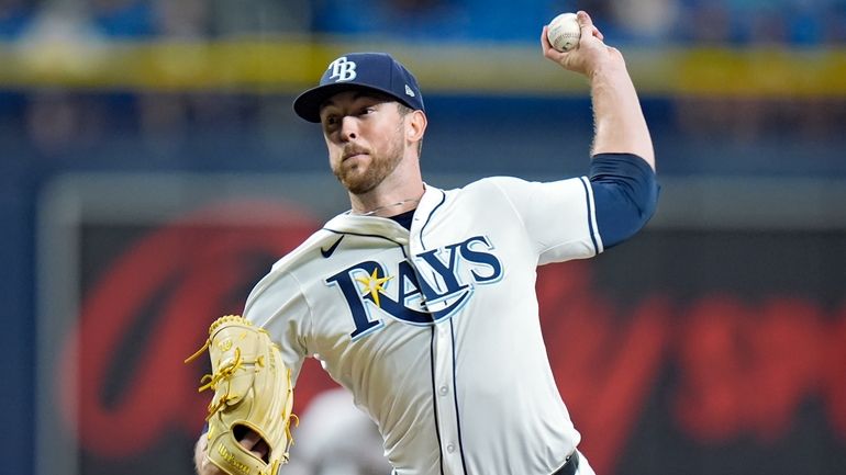 Tampa Bay Rays starting pitcher Jeffrey Springs delivers to the...