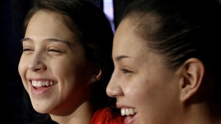 Louisville guard sisters Jude Schimmel, left, and Shoni Schimmel smile...