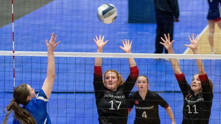 Center Moriches' Julia Hromada (17) Erin Baldock (4) and Megan...