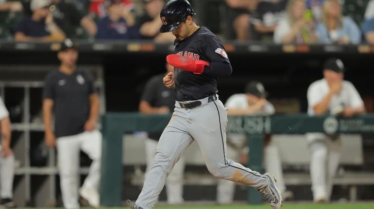 Cleveland Guardians' Steven Kwan scores on an Andrés Gimenez RBI...