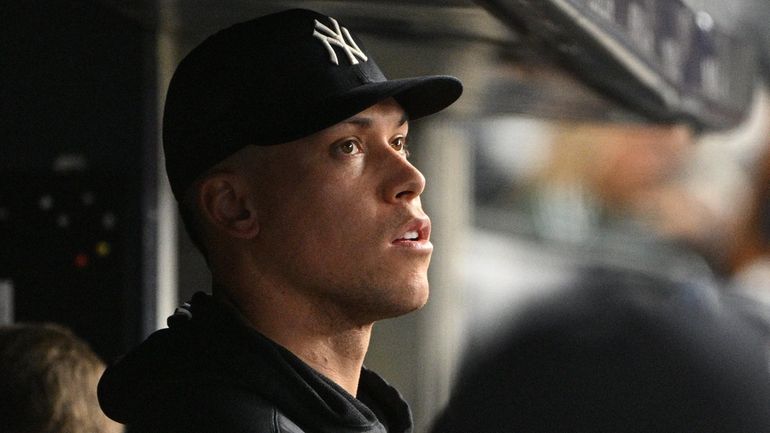 Yankees' Aaron Judge looks on against the Seattle Mariners during...