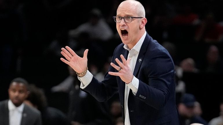 UConn head coach Dan Hurley calls towards his players during...