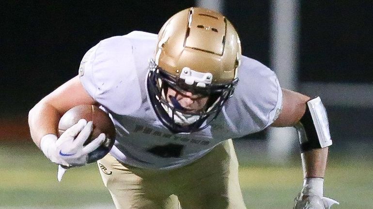 Bayport-Blue Point's Maclin Keyser gets taken down by Shoreham-Wading River's...