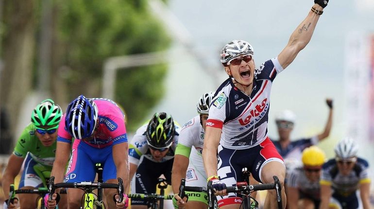 Andre Greipel of Germany and the Lotto-Belisol Team celebrate after...