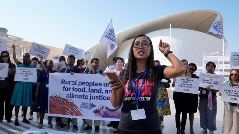 Activists demonstrate for rural people, food, land and climate justice...