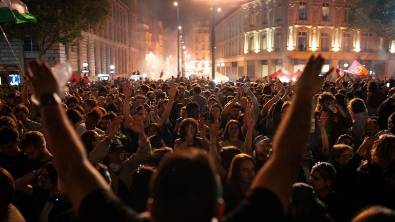 People gather at the Republique plaza after the second round...