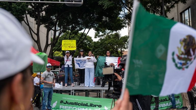 Judicial workers lead a strike to protest the government's proposed...