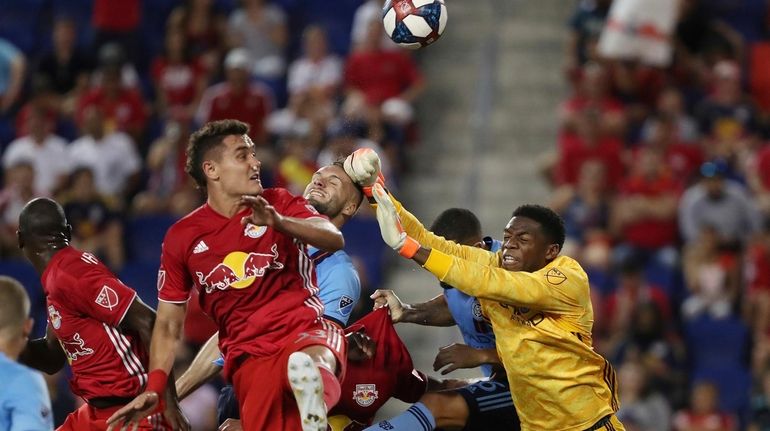 New York City FC goalkeeper Sean Johnson punches the ball...