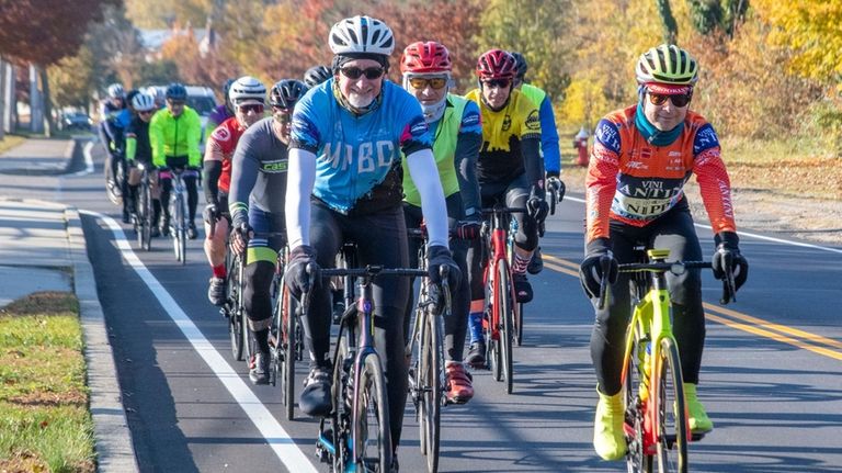 Brian MacKAY, front left, and a group of cyclists from...