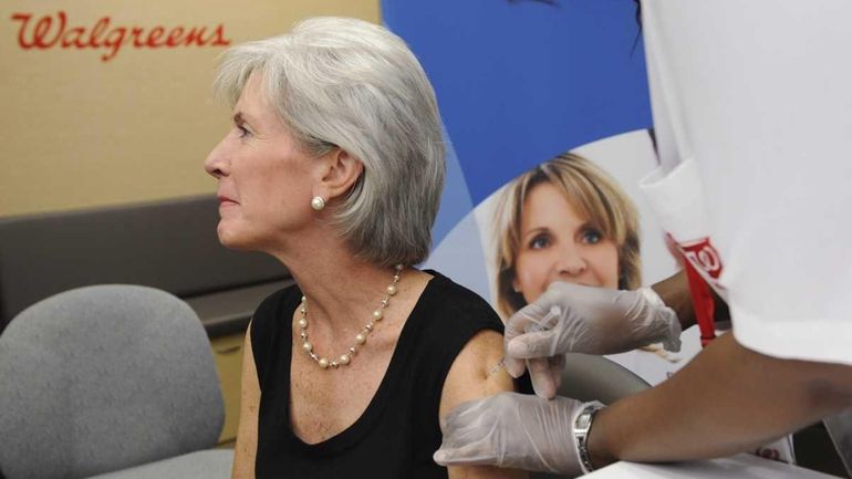 Health and Human Services Secretary Kathleen Sebelius gets a flu...