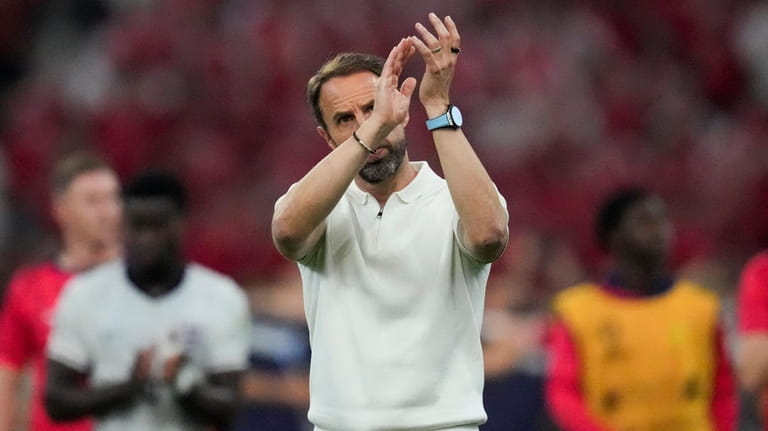 England's manager Gareth Southgate applauds after a 1-1 tie against...
