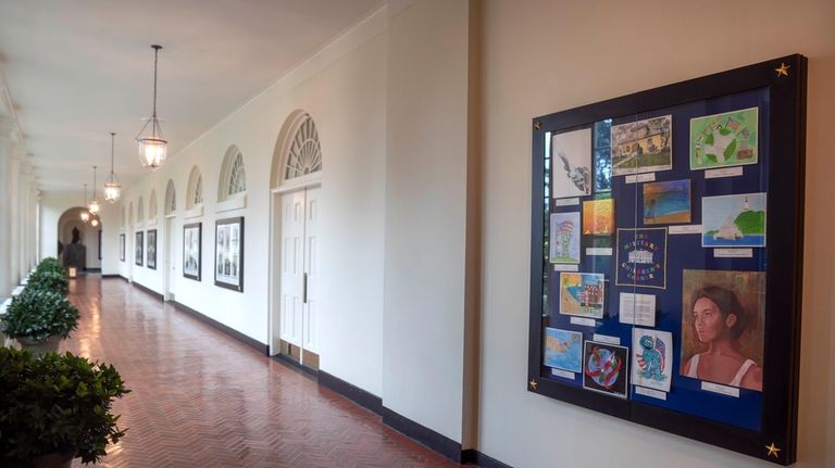 Artwork by military children decorates a display in the East...