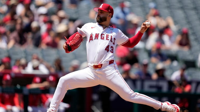 Los Angeles Angels starting pitcher Patrick Sandoval throws to the...