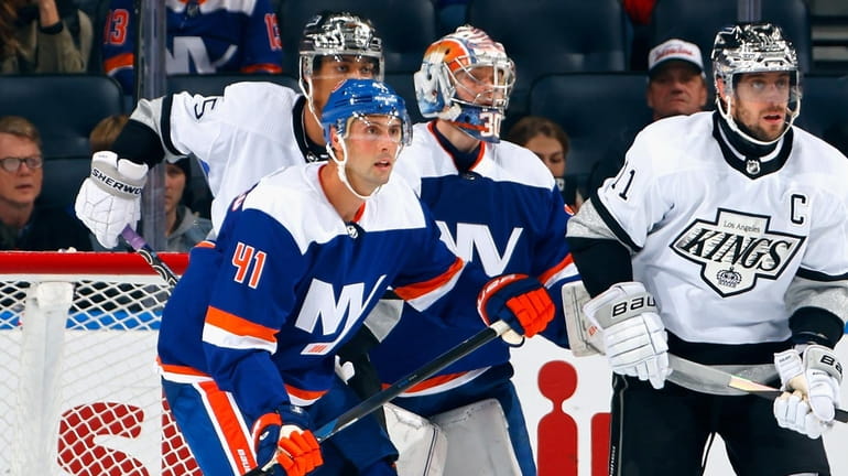 Robert Bortuzzo #41 of the New York Islanders defends the...