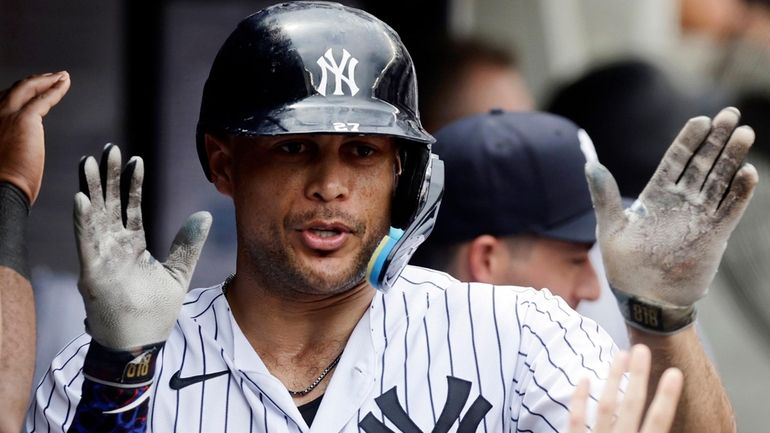 Giancarlo Stanton of the New York Yankees celebrates his fifth-inning...