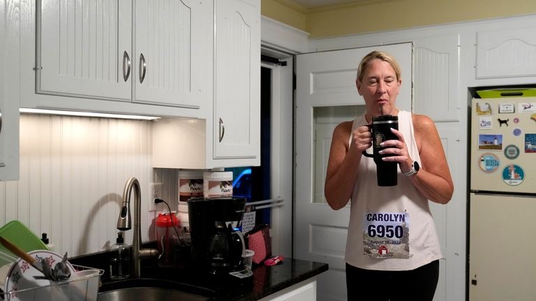 Carolyn Baker, a runner who suffered from heatstroke last year,...