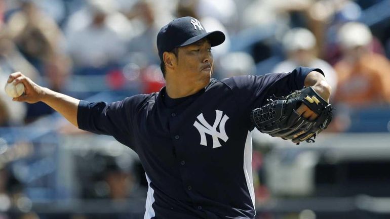 Yankees starting pitcher Hiroki Kuroda, of Japan, throws in the...