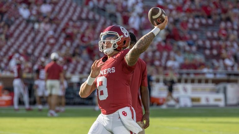 Oklahoma quarterback Dillon Gabriel warms up for the team's NCAA...