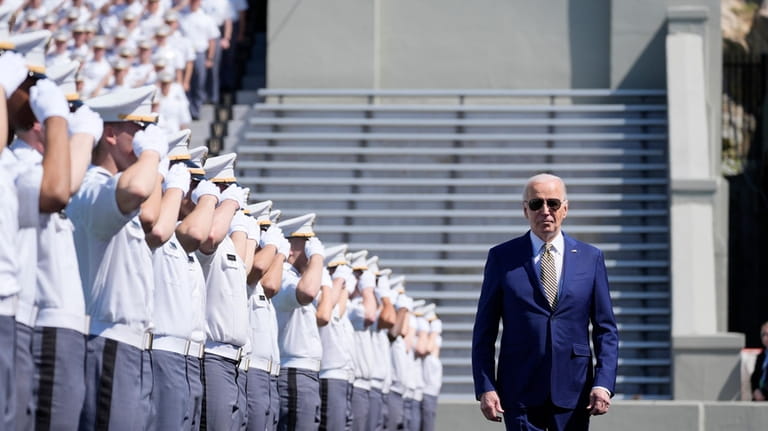President Joe Biden walks to speak to graduating cadets at...