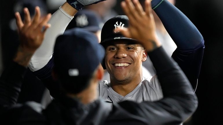 The Yankees' Juan Soto celebrates his third home run of...