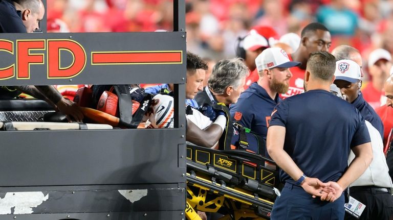 Chicago Bears safety Douglas Coleman III is loaded onto a...